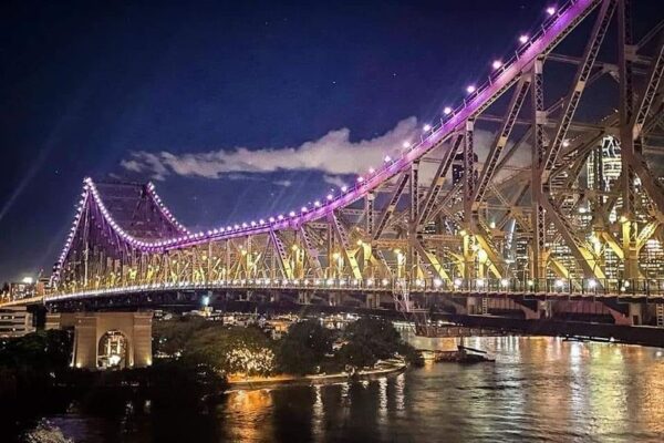 The Story Bridge is lit up purple tonight to honour HRH Elizabeth II a...