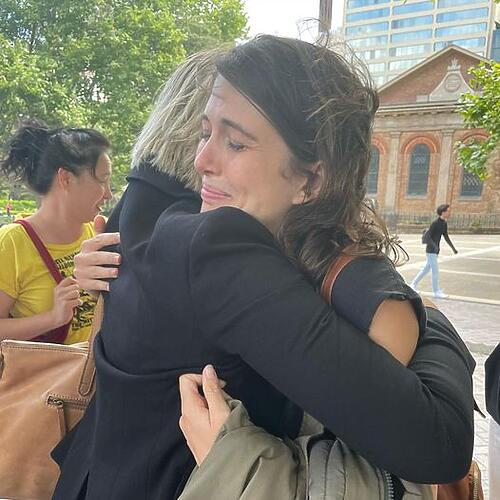 Violet Coco hugs Sue Higginson after speaking at an action today....