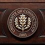 The oak leaf seal of the University of Connecticut.