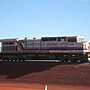 Old photo of a train in the Pilbara with signage Hamersly Iron