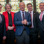 Representatives of the five North East universities stood in front of a stained glass wiindow