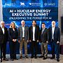 6 national laboratory leaders are standing in front of a sign that reads