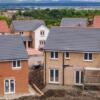Housing estate under construction with two almost finished in the foreground
