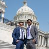 two people standing outside U.S. Capitol building